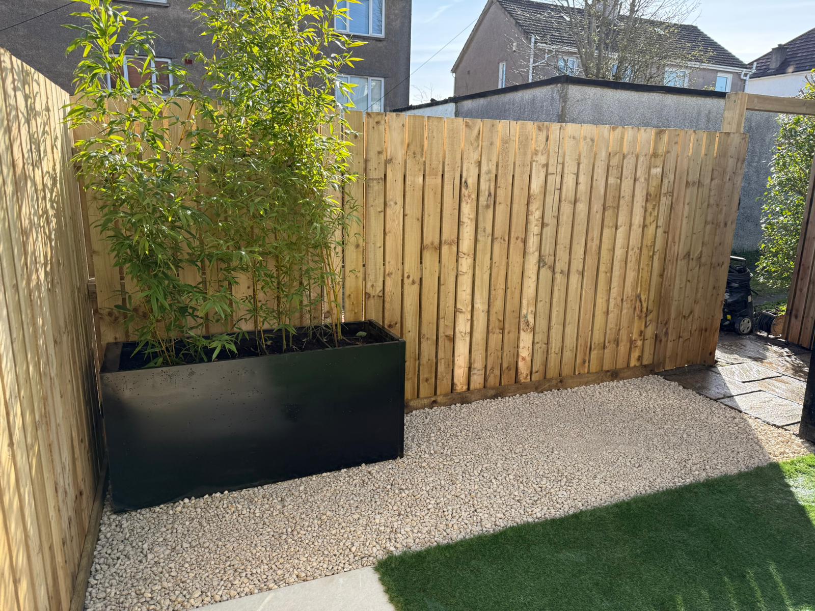 Artificial grass installation with fencing and porcelain, Waterfoot